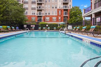 Pool With Relaxing Chairs at The Reserve at Riverdale, New Jersey, 07457